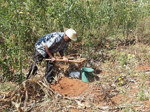 Digging_for_samples_of_soil-lr